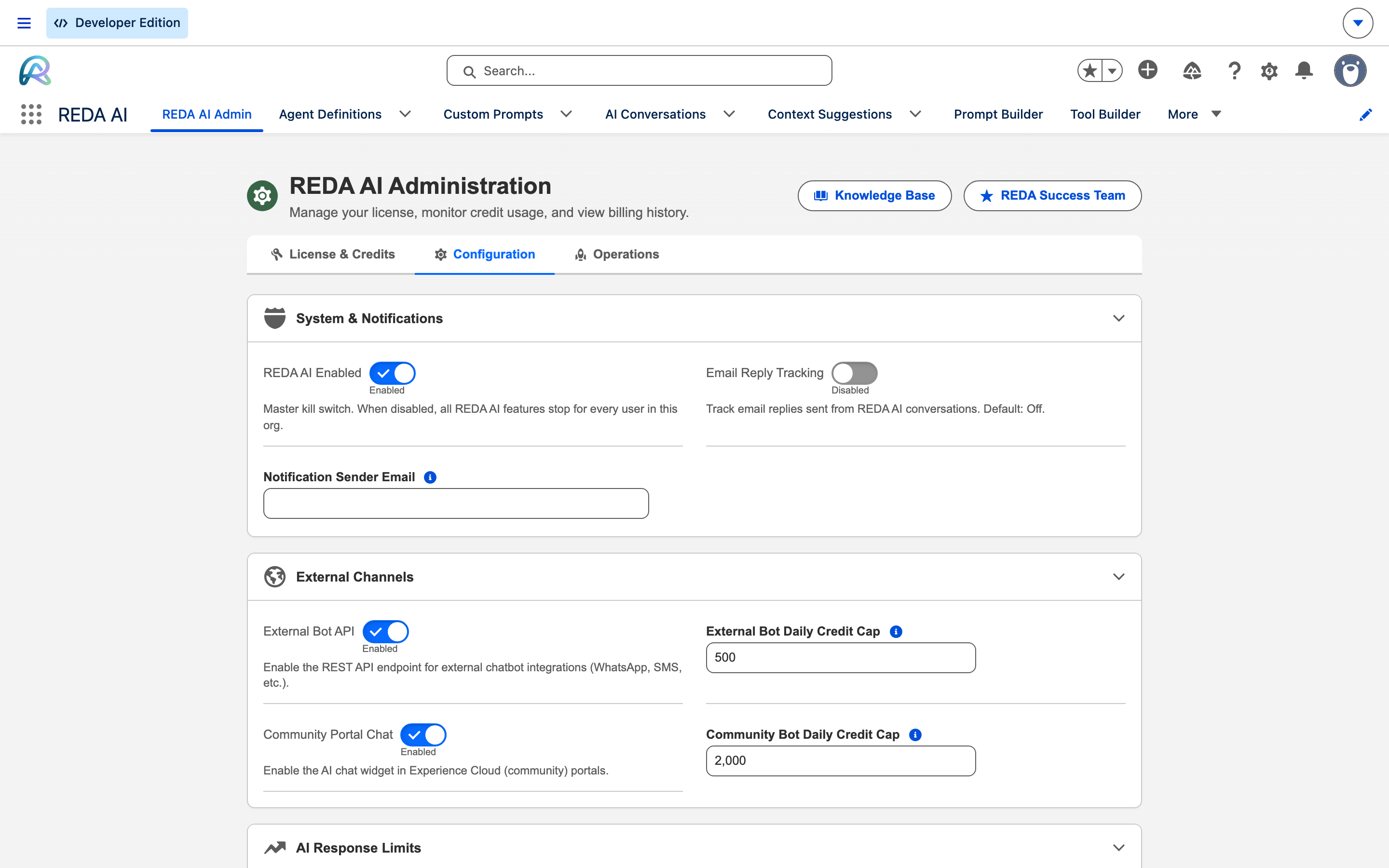 The Configuration sub-tab of REDA AI Administration. System and Notifications holds the REDA AI Enabled master switch, Email Reply Tracking and the Notification Sender Email field. External Channels holds the External Bot API and Community Portal Chat toggles with their daily credit caps of 500 and 2,000. AI Response Limits follows below.