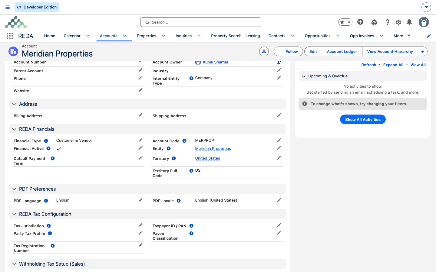 La pestaña Details de un registro de cuenta, sección REDA Financials, con Financial Active marcado y Account Code, Entity y Territory completos.